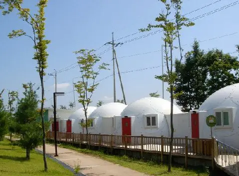 Homeless4 Group of tiny houses or safety shelters with red doors from InterShelter Inc.